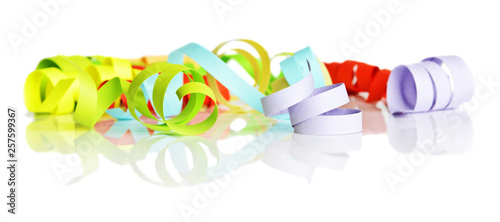 Multicolored streamers on a white background photo