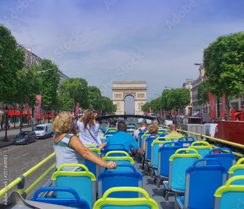 Valokuva tourist bus in Paris France. Champs Elysees boulevard in summer
