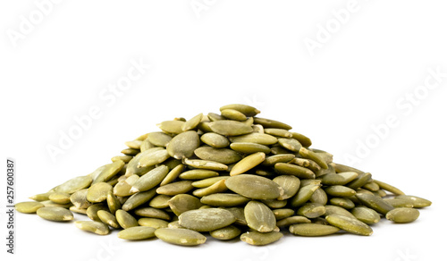 Heap of pumpkin seeds on a white background. Isolated.