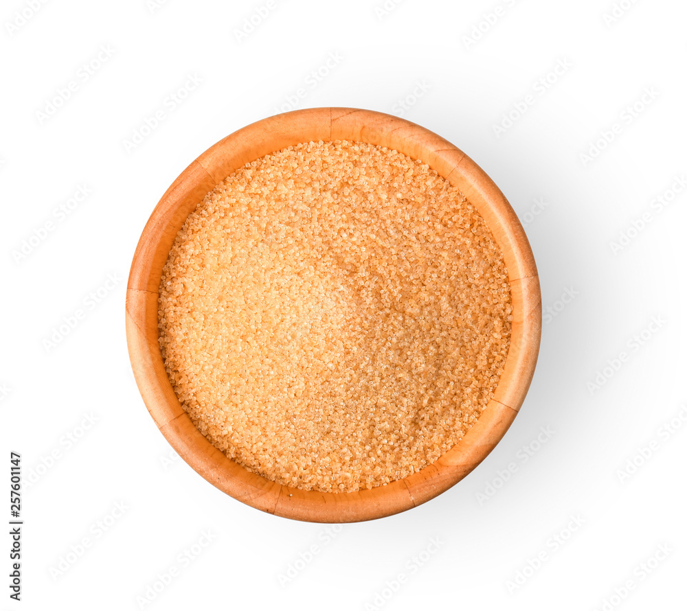 Brown refined sugar in wooden bowl on white background. Brown refined sugar in wooden bowl on white background.