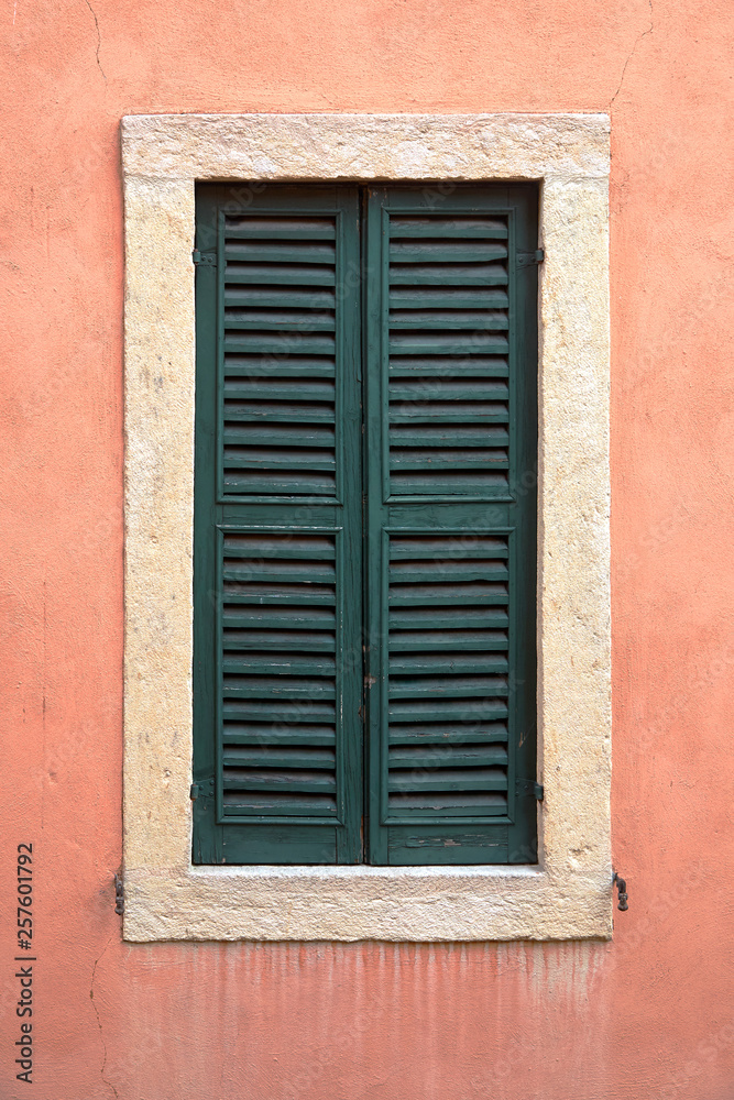 One window with closed shutters.
