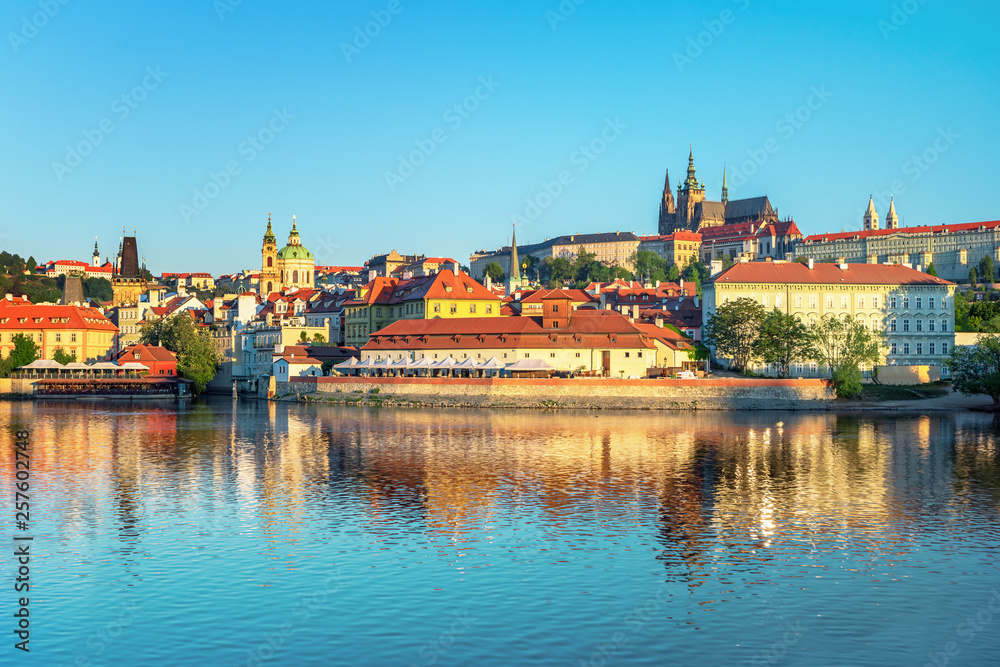 Obraz premium Scenic view Charles bridge and historical center of Prague, buildings and landmarks of old town at sunset, Prague, Czech Republic