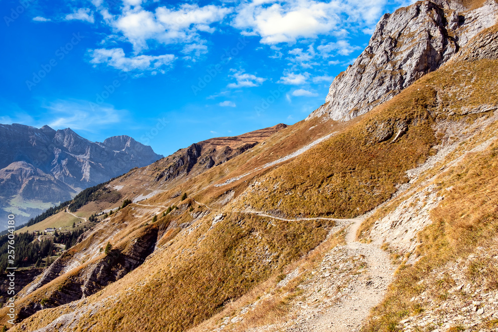 View over alpine winding mountain path in Switzerland