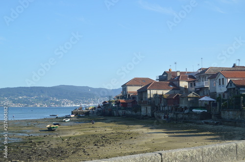 Beautiful Views Of The Horreos And Houses With The Low Tide In Combarrro. Nature, Architecture, History, Street Photography. August 19, 2014. Combarro, Pontevedra, Galicia, Spain.