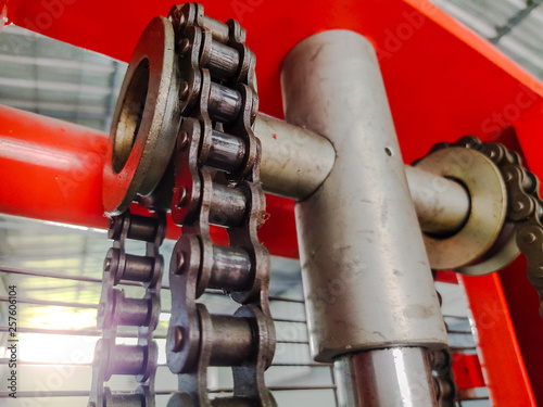 Sun shines falling chain of forklift in factory