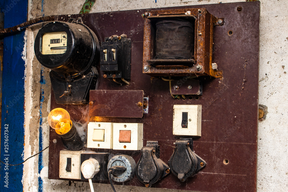The old cabinets with wiring and piping of the electrical system control in small factory for automation works The old cabinets with wiring and piping of the electrical system control in small factory for automation works