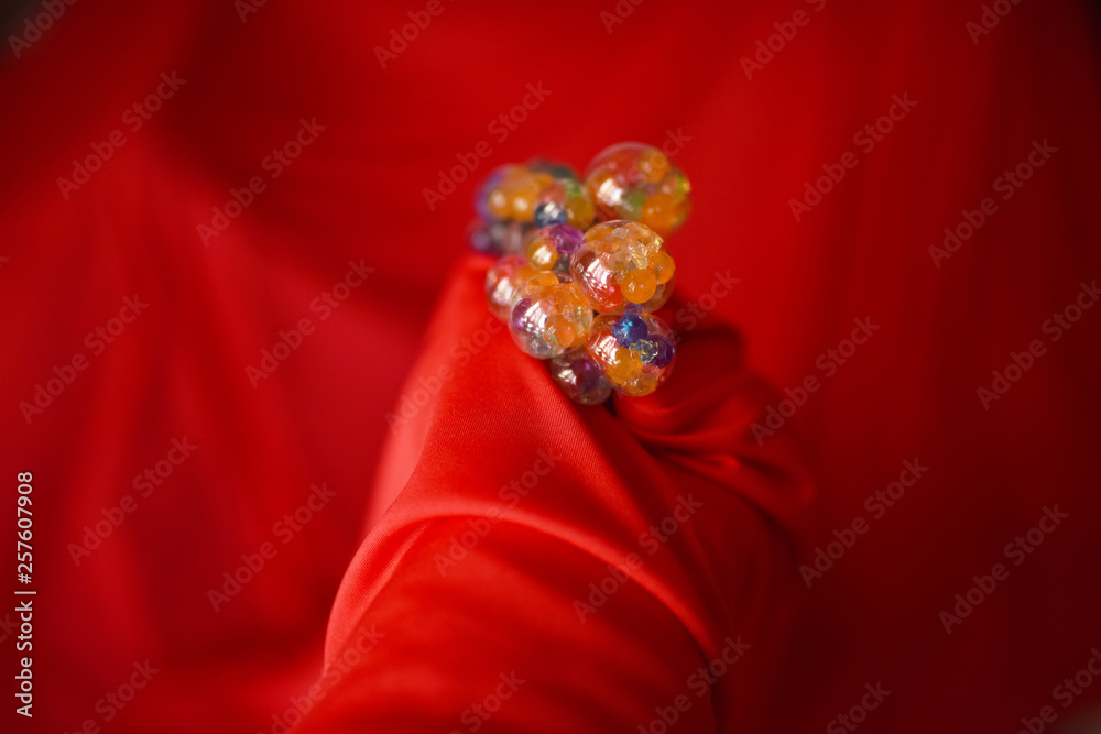 multicolored bubbles HB red fabric background multicolored bubbles HB red fabric background