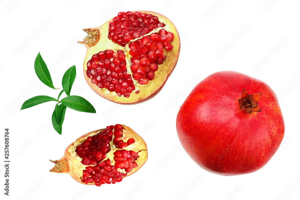 piece of pomegranate with seeds and green leaves isolated on a white background. top view piece of pomegranate with seeds and green leaves isolated on a white background. top view