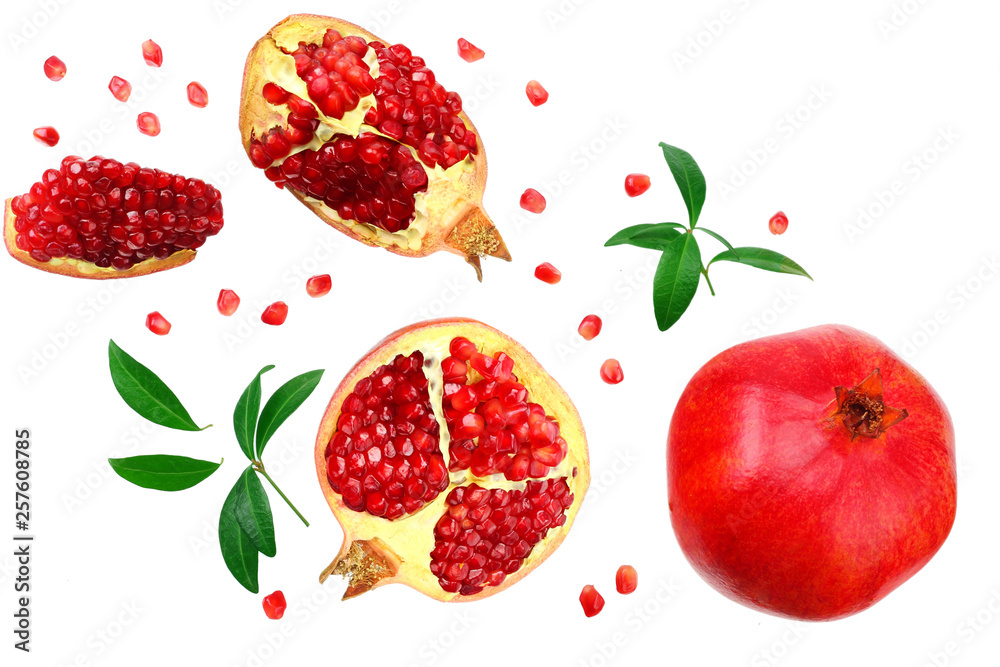 piece of pomegranate with seeds and green leaves isolated on a white background. top view piece of pomegranate with seeds and green leaves isolated on a white background. top view
