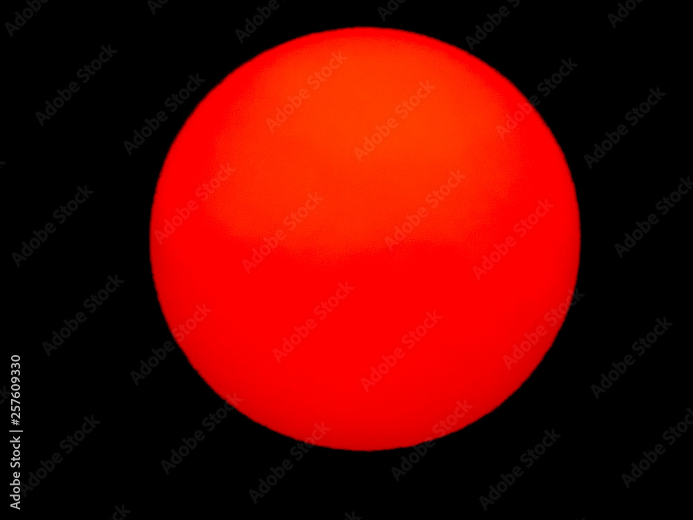 Beautiful big sunset over sea. Tranquil scene of Closeup red sun and red sky sunset over the ocean