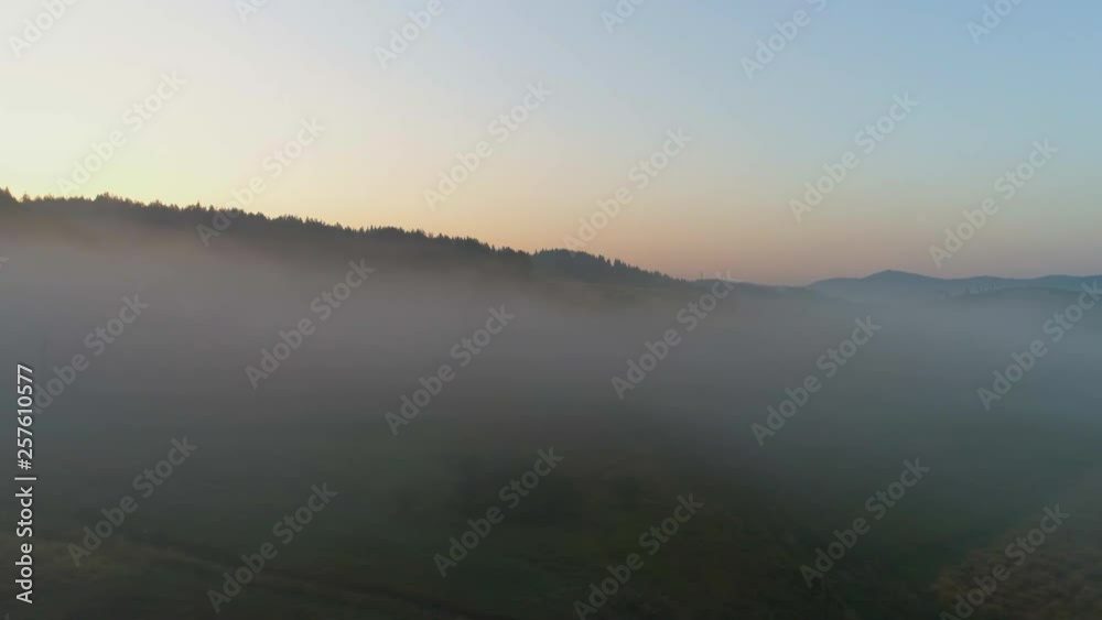 mountains enveloped by mist early in the morning mountains enveloped by mist early in the morning