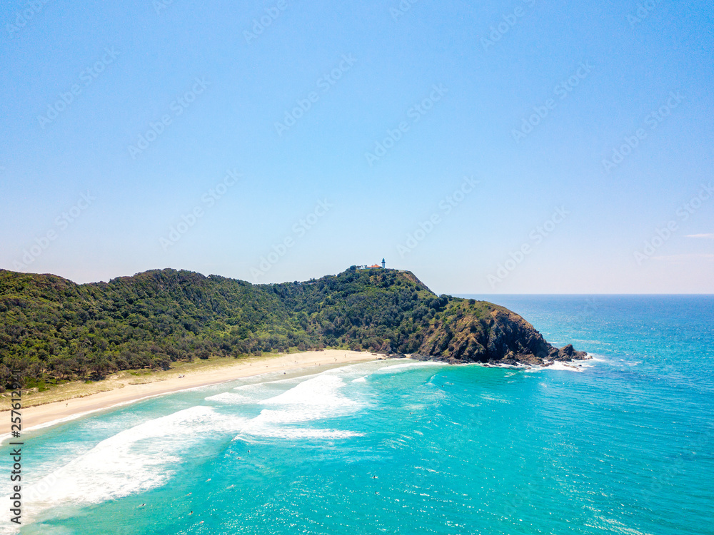 Tallows Beach at Byron Bay from an aerial view with blue water