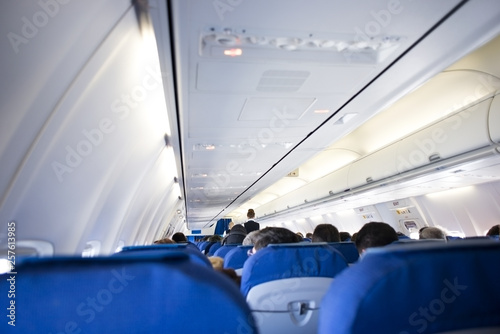 Inside commercial aircraft with passengers  © adrian_ilie825