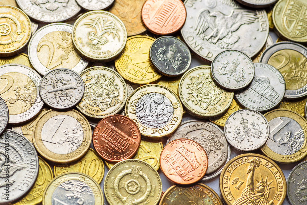 Background of Euro coins money.United kingdom Pound coin.US coins.Group of coins Background of Euro coins money.United kingdom Pound coin.US coins.Group of coins