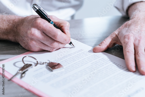 Real estate contract signature (Lorem ipsum text used)