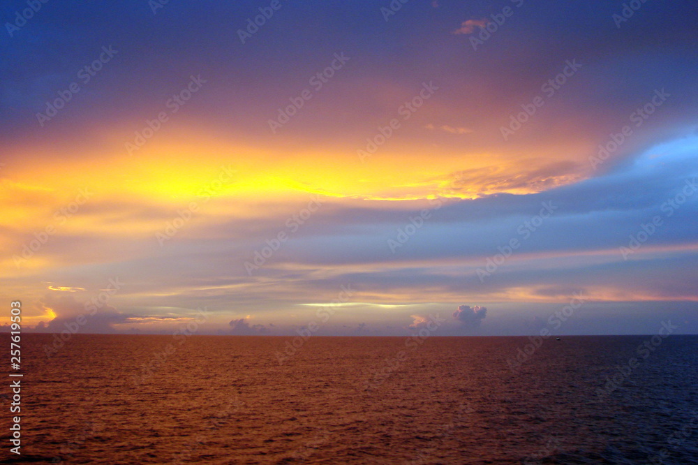 The landscape from the deck of the ocean liner is incredible beauty of the bright natural scenery of the sunset on the sea horizon.