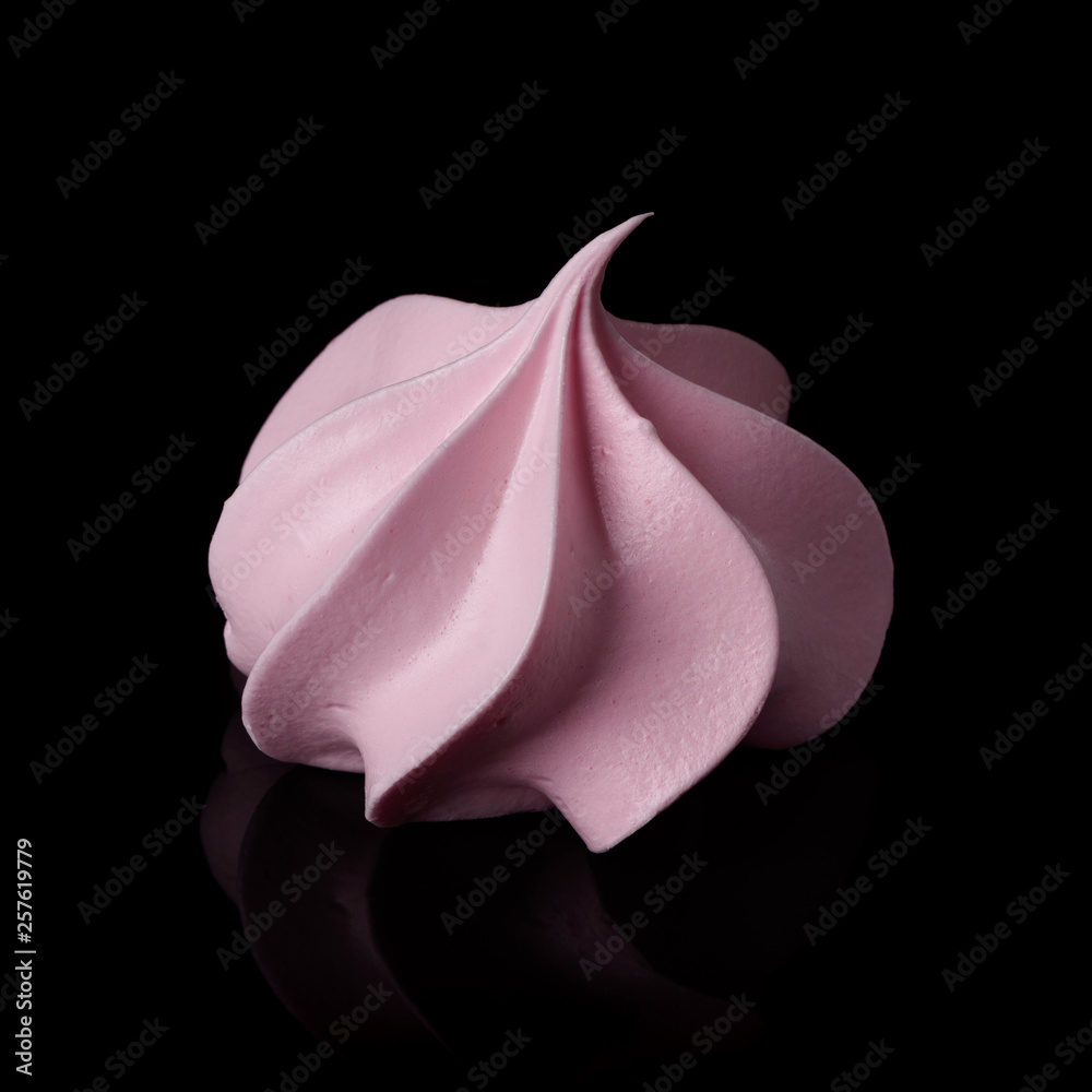 Sweet cripsy pink meringue isolated on black with reflection. Sweet cripsy pink meringue isolated on black with reflection.
