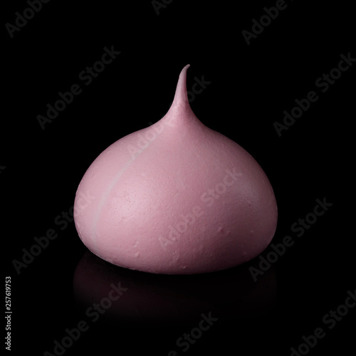 Meringue cookine pink isolated on black background with reflection. photo
