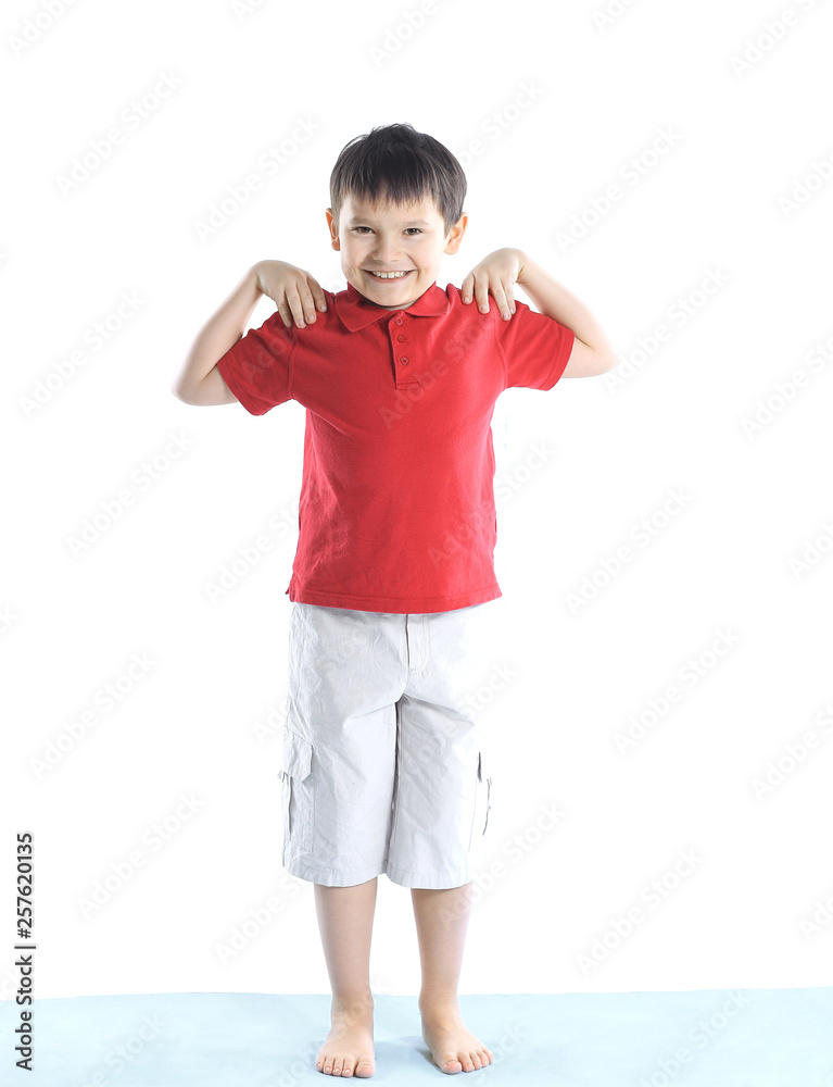 little boy performs morning exercises.isolated on white. photo with copy space little boy performs morning exercises.isolated on white. photo with copy space