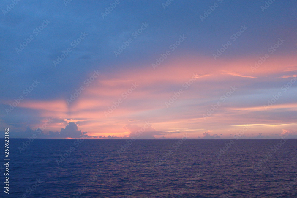 The landscape from the deck of the ocean liner is incredible beauty of the bright natural scenery of the sunset on the sea horizon. The landscape from the deck of the ocean liner is incredible beauty of the bright natural scenery of the sunset on the sea horizon.