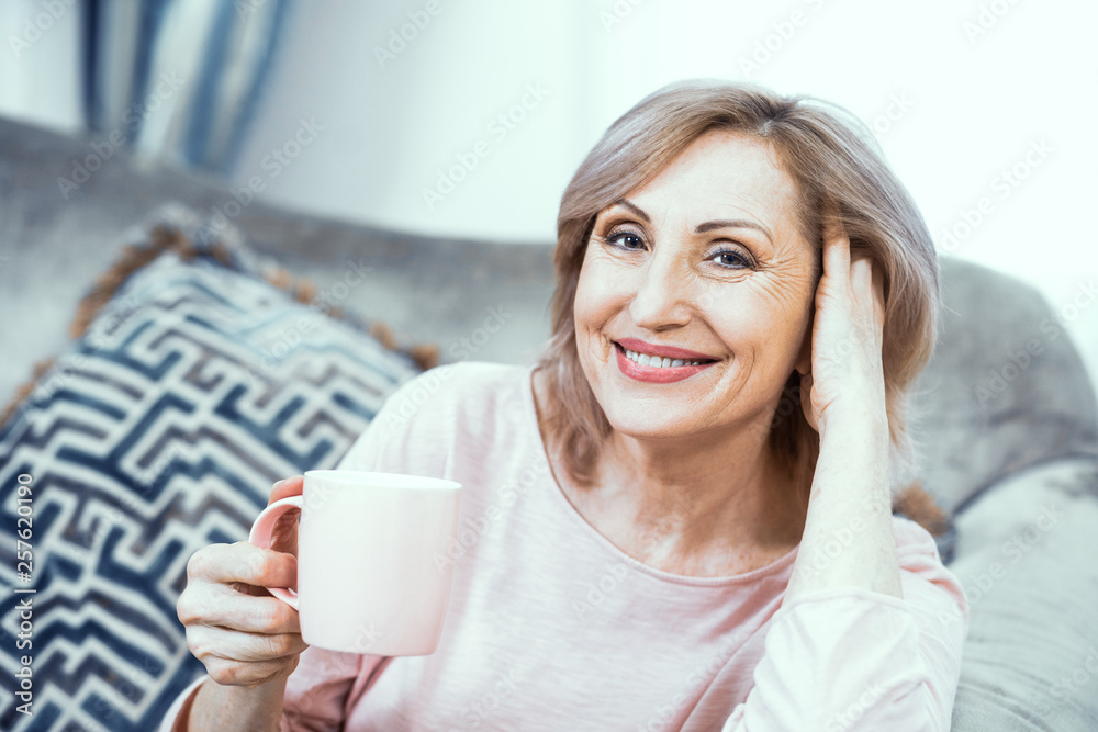 Attractive middle aged woman relaxing at home Attractive middle aged woman relaxing at home
