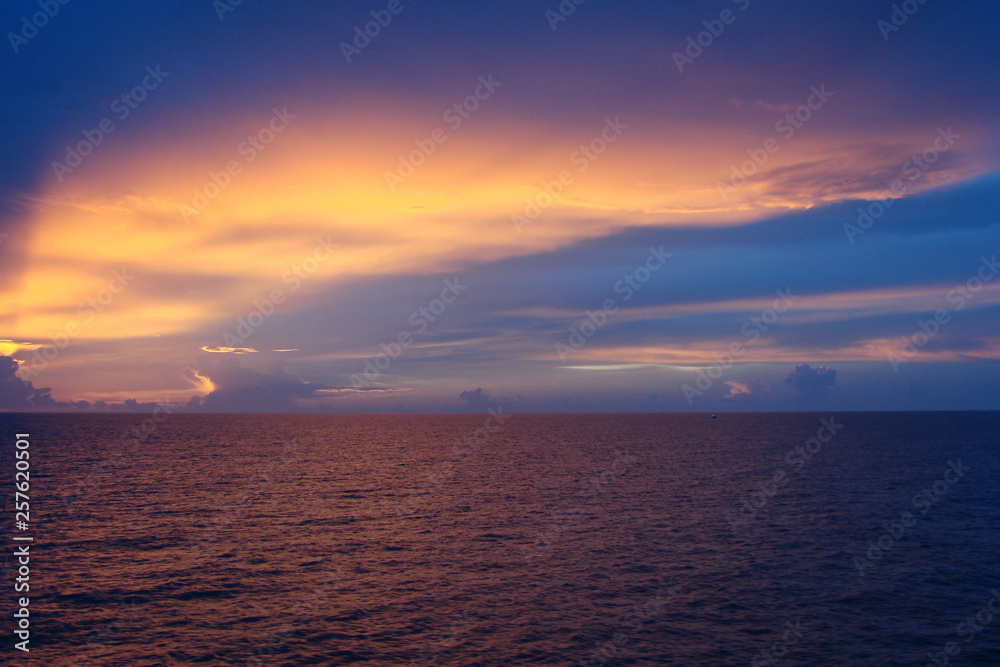 The landscape from the deck of the ocean liner is incredible beauty of the bright natural scenery of the sunset on the sea horizon. The landscape from the deck of the ocean liner is incredible beauty of the bright natural scenery of the sunset on the sea horizon.