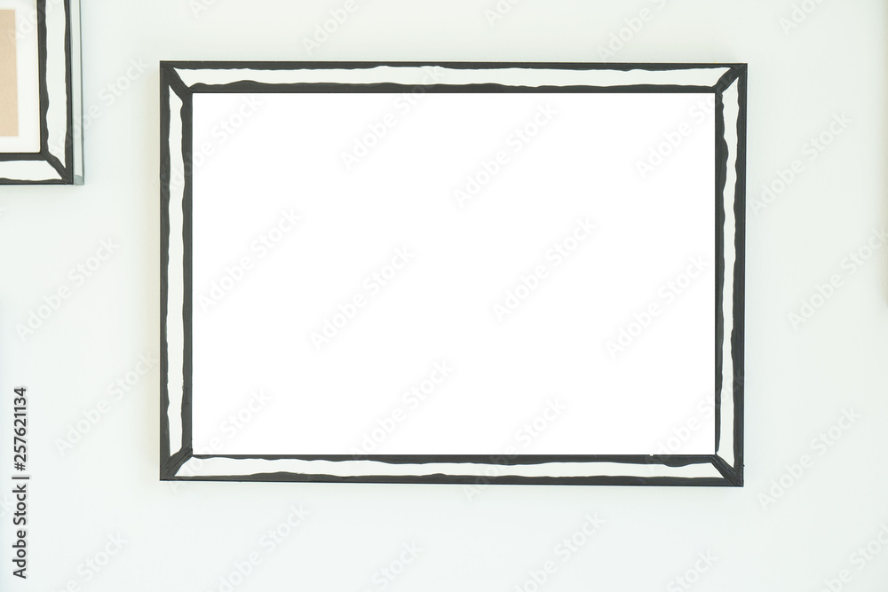 empty frame on white wall  .Blank space for text and images.