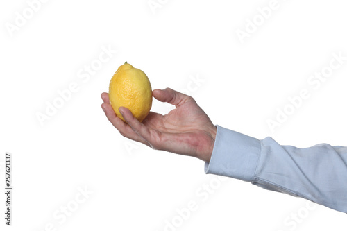 male man holding a lemon isolated on white background with clipping path and copy space for your text