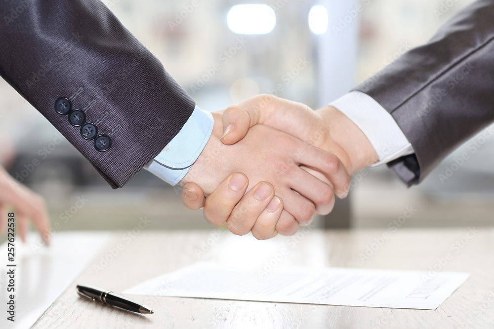 close up. handshake business partners after signing the contract.