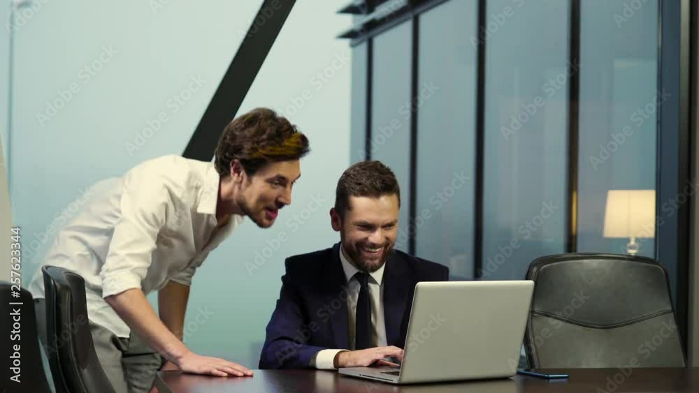 Young businessmen are happy about the success of their company. Young businessmen are happy about the success of their company.