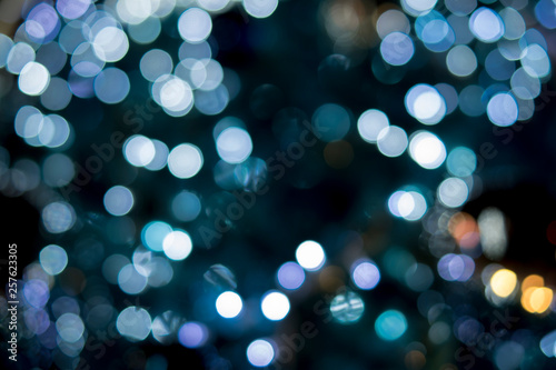 Christmas tree decorations such as gifts, light, color, dolls make beautiful. The light is bokeh.