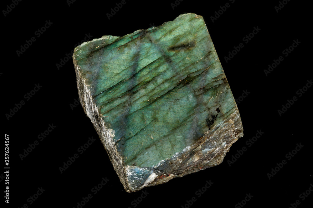 Macro of the stone Labradorite mineral on a black background Macro of the stone Labradorite mineral on a black background