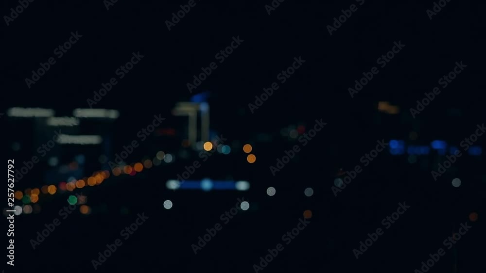 Young blond male breathes out large stream of fire making fireball. Slow motion close-up