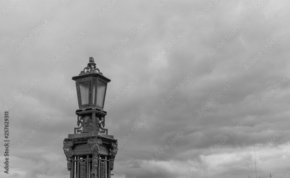 Lamppost against a cloudy sky