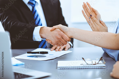 Business people shaking hands, finishing up a meeting