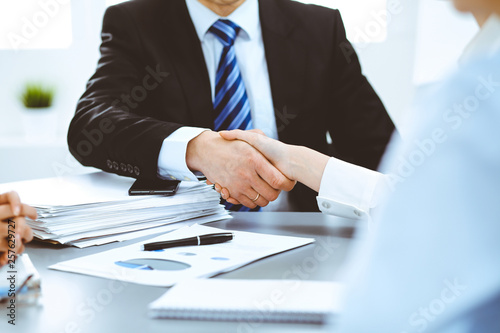 Business people shaking hands, finishing up a meeting photo