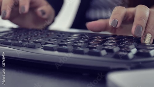 Camera slides around business hands typing on laptop keyboard in slow motion. Businesswoman working at office with internet. woman searches new job on internet at office. Business con