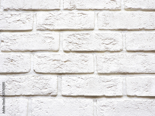 Background and texture of white tiles for facing the facade of the building in the form of bricks..
