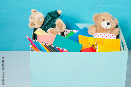 Box with donations for children with school supplies and toys © netrun78