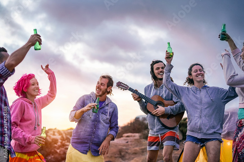 Photography Happy friends making party at sunset while camping next the beach - Young people