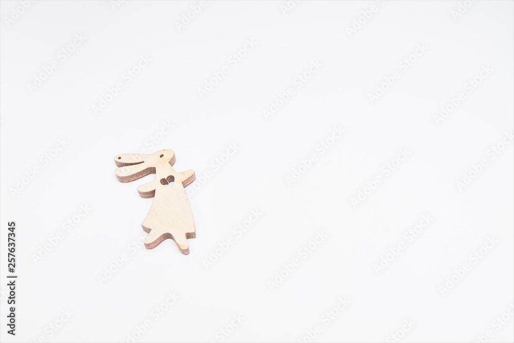 Easter eggs hunt - wooden bunny female on white background