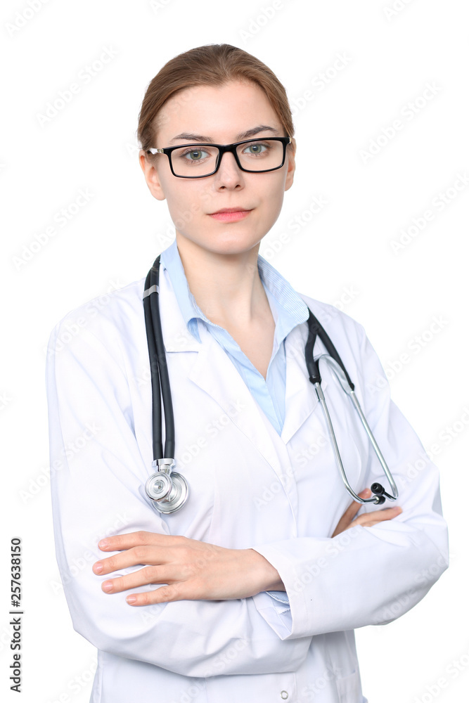 Young brunette female doctor standing with arms crossed. Isolated over white background Young brunette female doctor standing with arms crossed. Isolated over white background