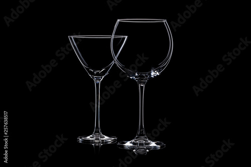 Glassware silhouettes on black.