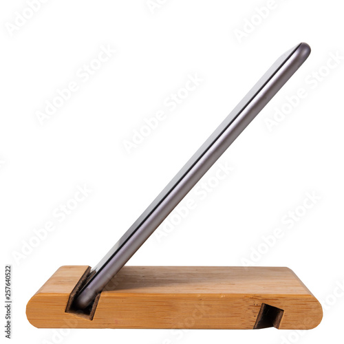 Wooden stand for modern mobile smartphone on white background