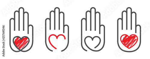 Red heart of love in the palm