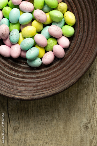 Speckled chocolate easter eggs on wood background.