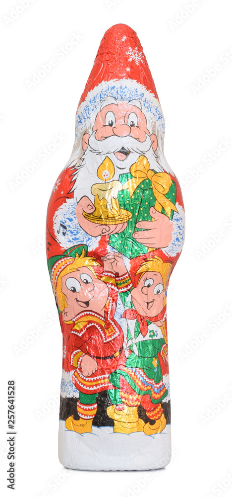 Santa Claus chocolated figure wrapped into foil isolated on white