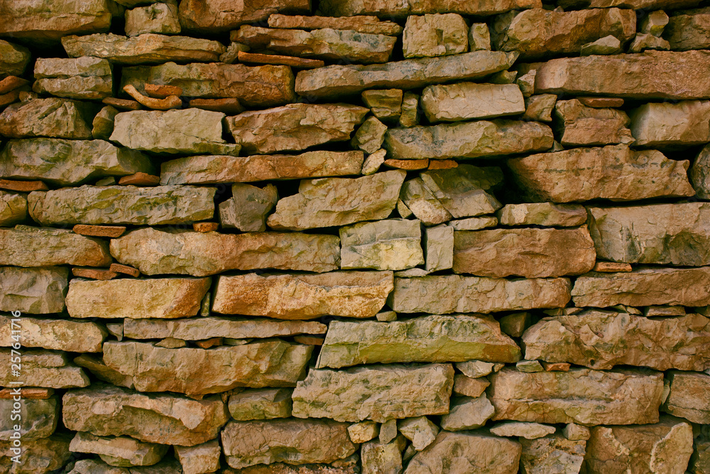 Fototapeta premium Old multicolored stone wall