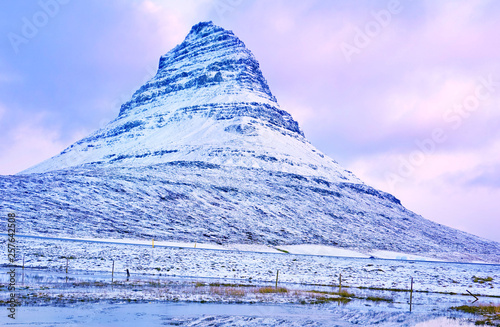 View of the Kirkjufell Mountain at the beachside in Iceland at sunset in winter. photo