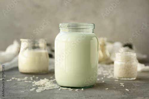 Jar of healthy rice milk on table